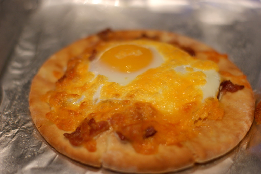 The egg yolk acts as the pizza sauce in this deliciously simple recipe.