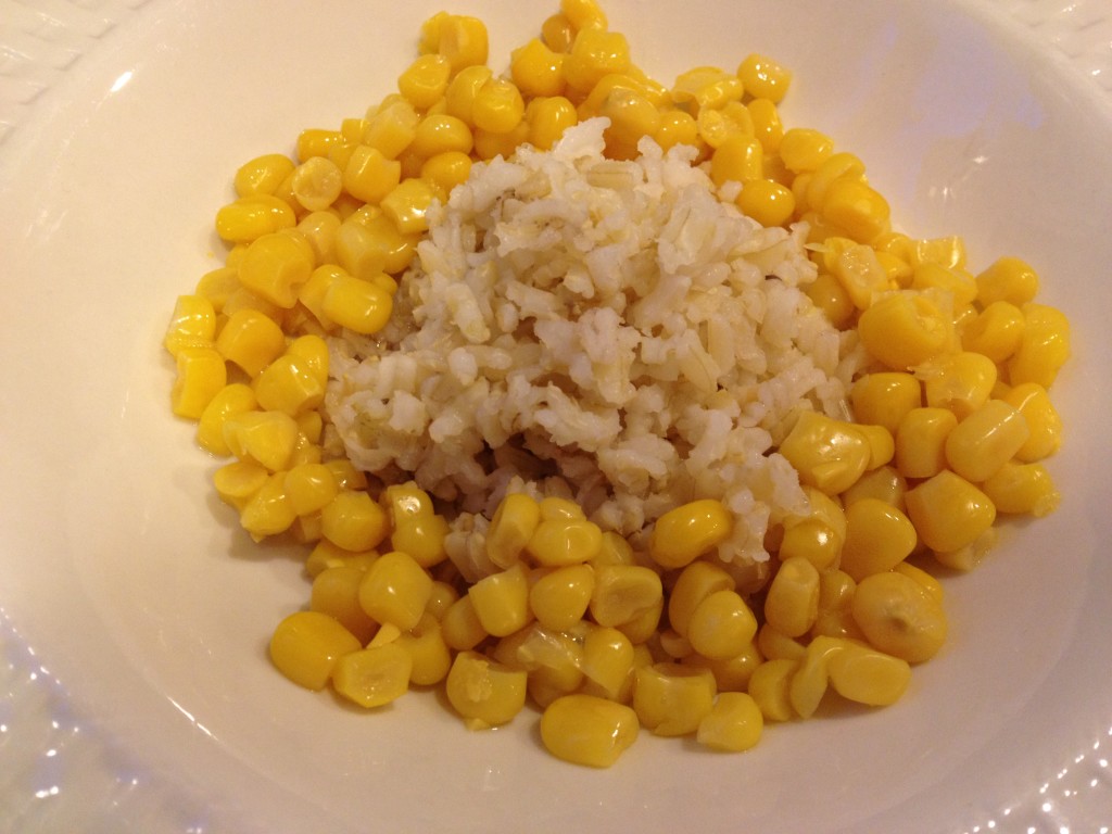 Top rice with corn.  I used corn from two cobs.  To cook the corn, I wrapped the ears in foil and cooked in a 350 degree for about 15 minutes.  Then I ran my knife from the top to the bottom of ear to remove the kernels.