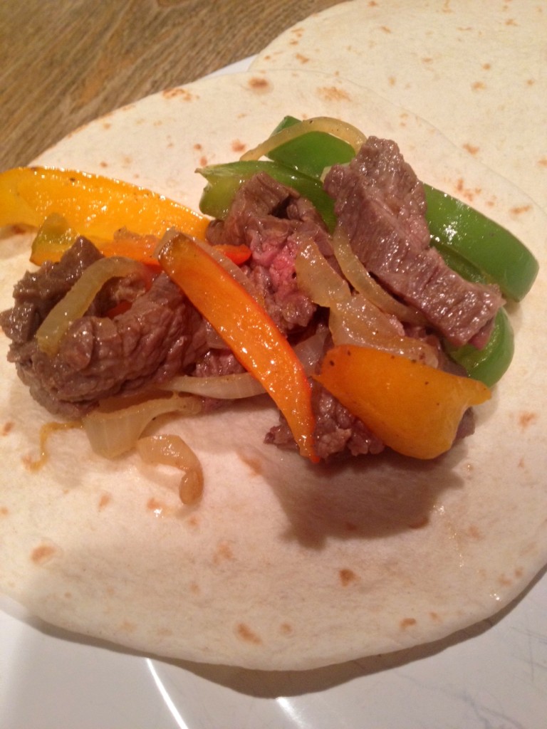 Warm, soft flour tortillas topped with tender steak and veggies.  